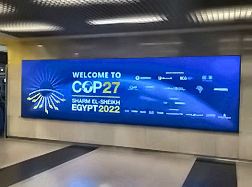 COP27 airport lightbox